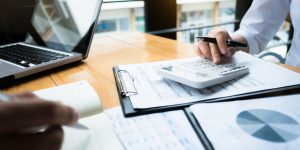 business person using calculator